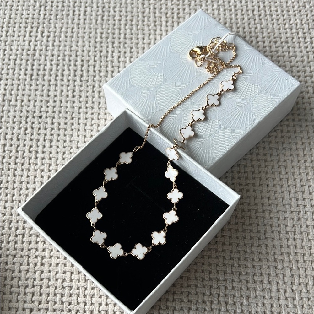 Elegant Gold tone and White enamel Clover Necklace new in box
